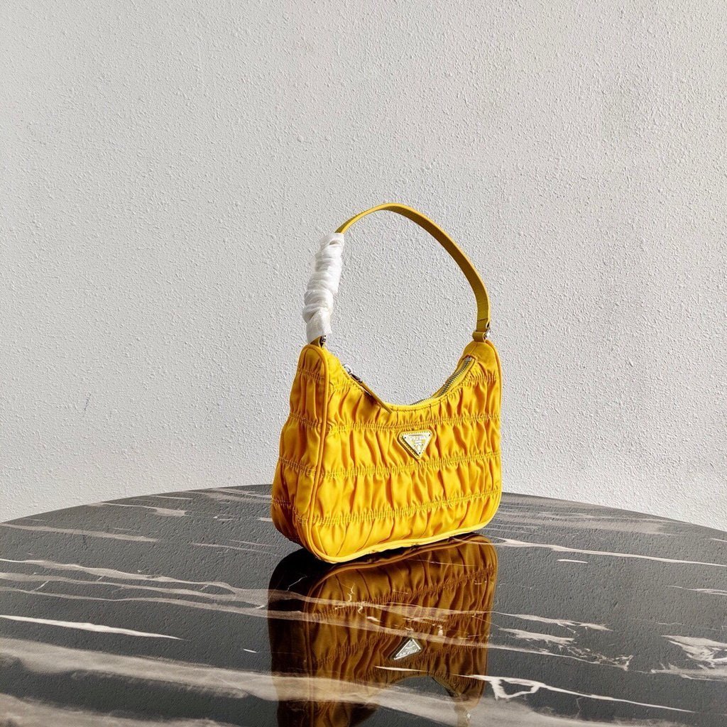 Our Factory offer best Designer HIGH quality replica handbags in cheaper price! Up to 70% discount now. Quality Guarantee! Fast Shipping Worldwide Replica Prada 1NE204 Prada Nylon and Saffiano Leather Mini Bag in Yellow39187 - Image 1