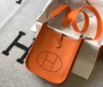 Replica Hermes Evelyne Bag Hermes Mini Crossbody Bag 20405 Silver Buckle Orange35087